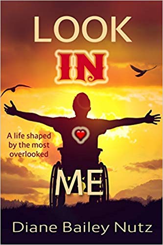 Image of book cover for Look In Me. Shows silhouette of a man in a wheelchair in front of a sunset.