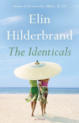 Cover of the book The Identicals by Elin Hilderbrand, showing two people standing under an umbrella on the beach