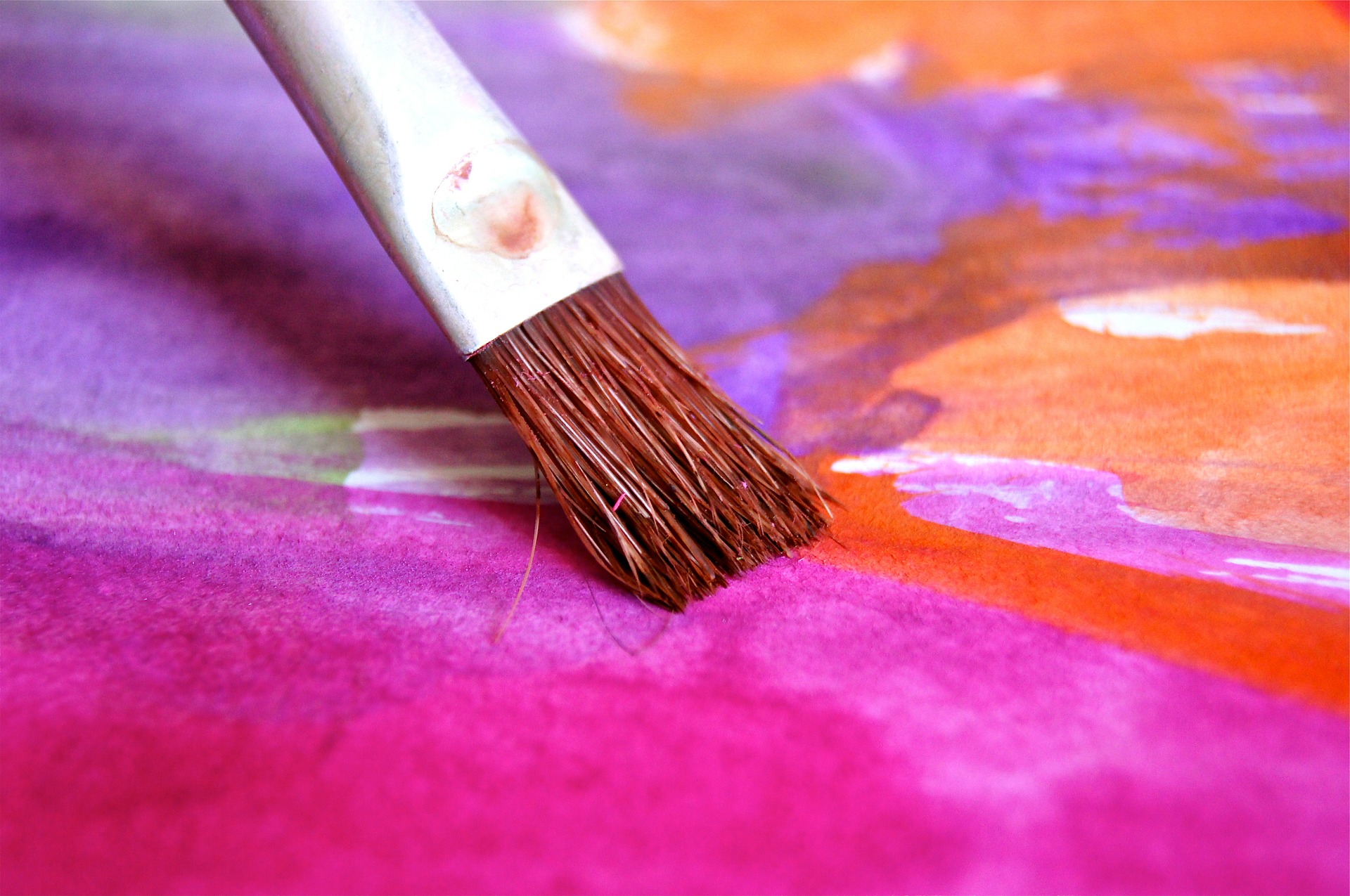 closeup of paintbrush and watercolors