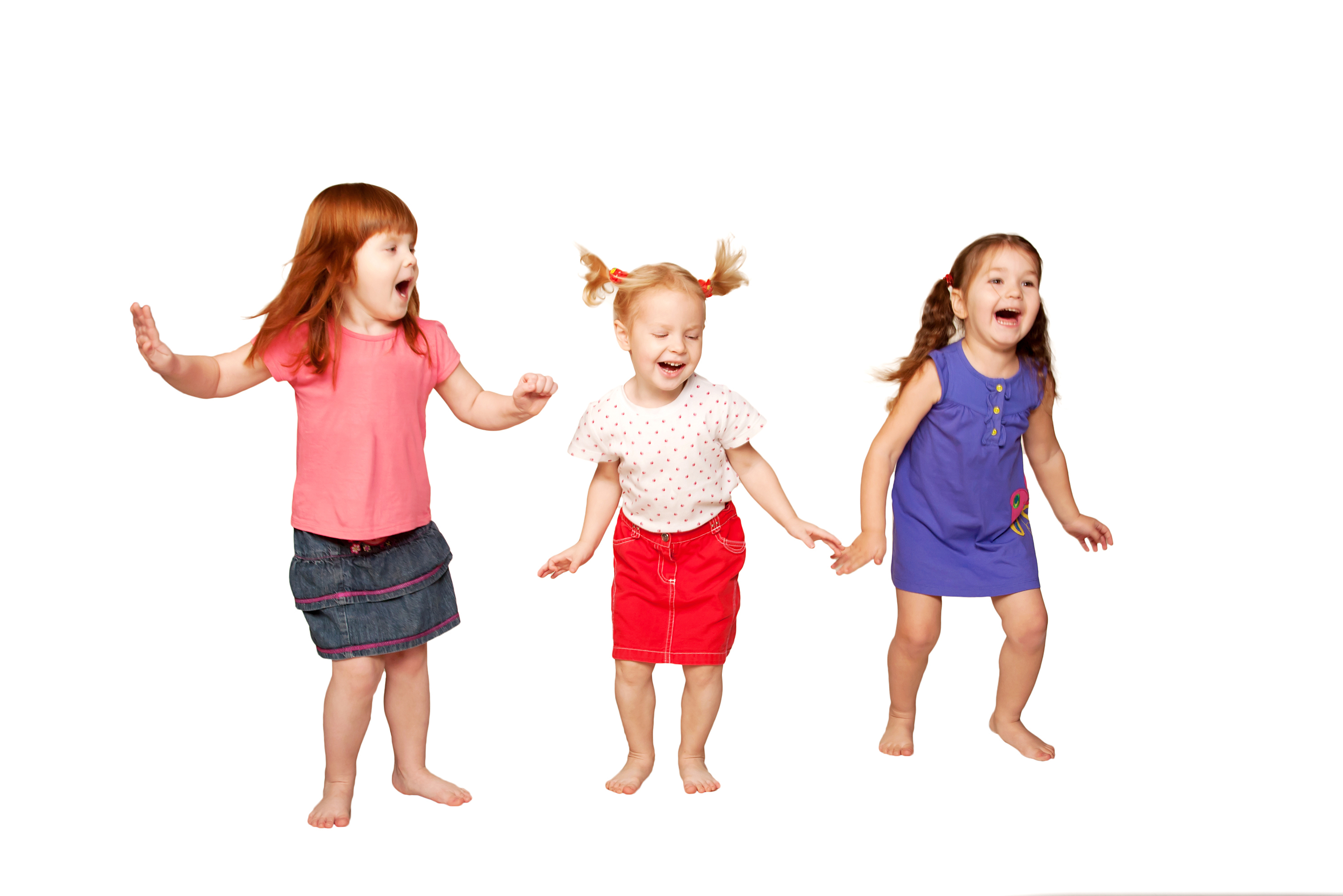 Three toddlers jumping on a white background.