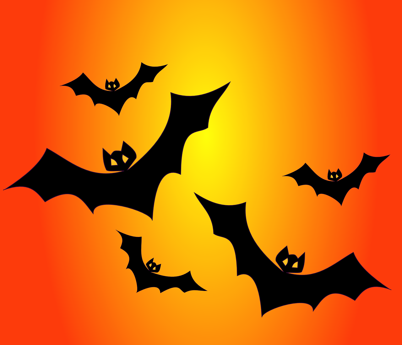 Silhouettes of bats on an orange background