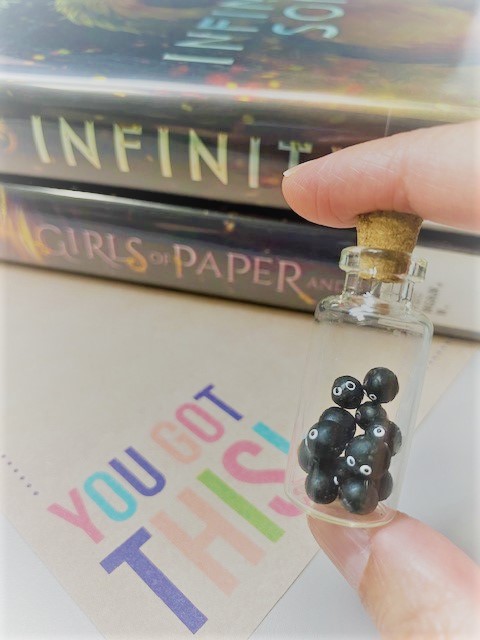 Soot Sprites with YA books in the background