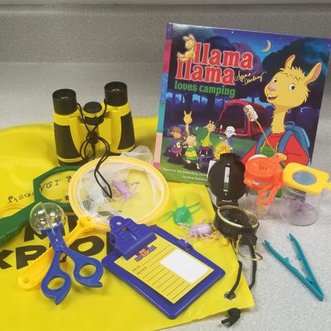 Image of play camping equipment and book