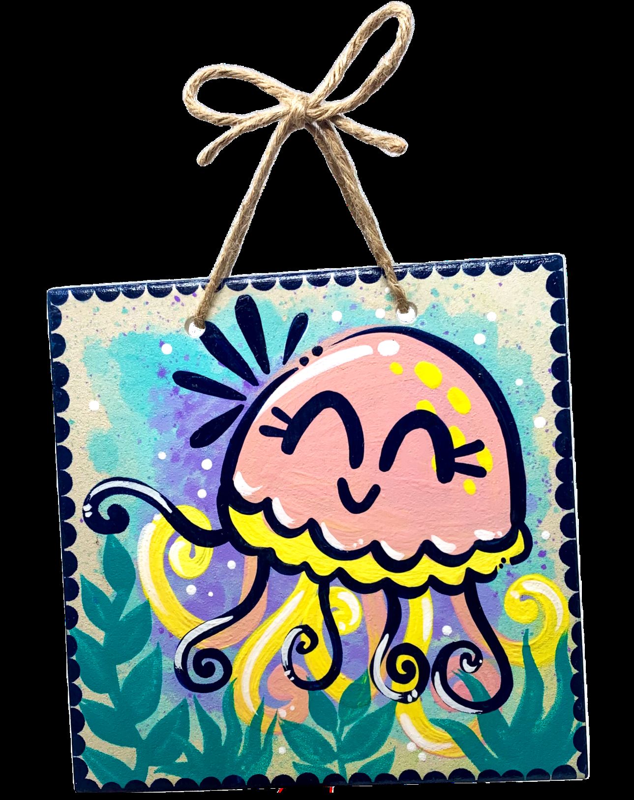 Hanging ceramic tile with pink smiling jellyfish and undersea plants painted on it, on a black background