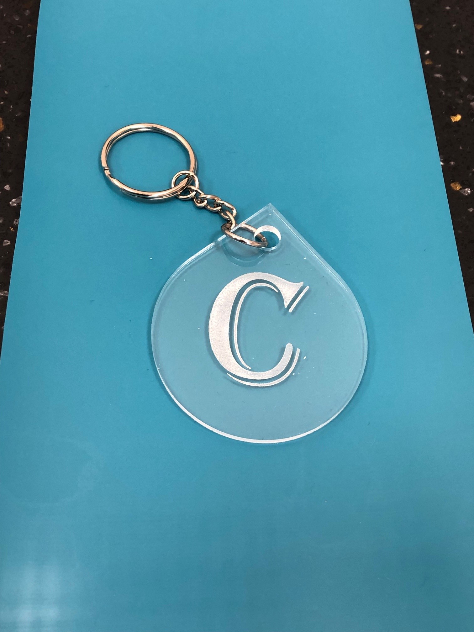 clear keychain with initial C on it