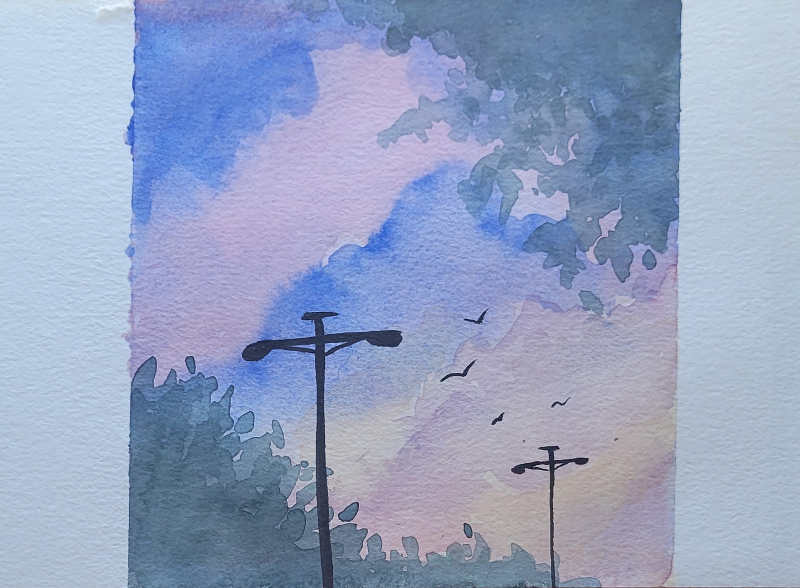 Watercolor painting of telephone poles and birds in the distance.  The background is blue and pink like a sky towards the end of sunset with the green leaves of two trees in two corners diagonally across from each other.