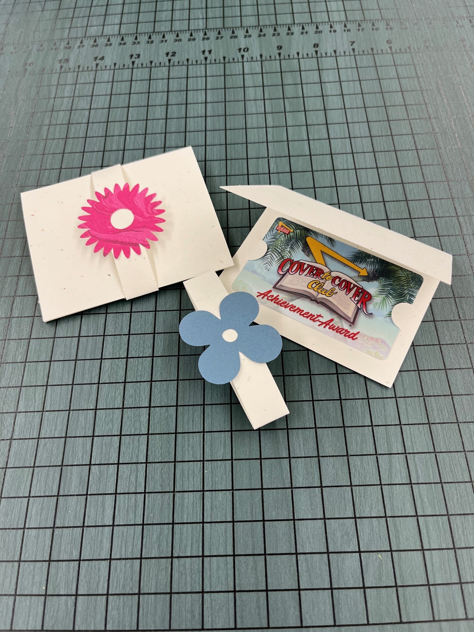 paper folder with colored flower embellishment
