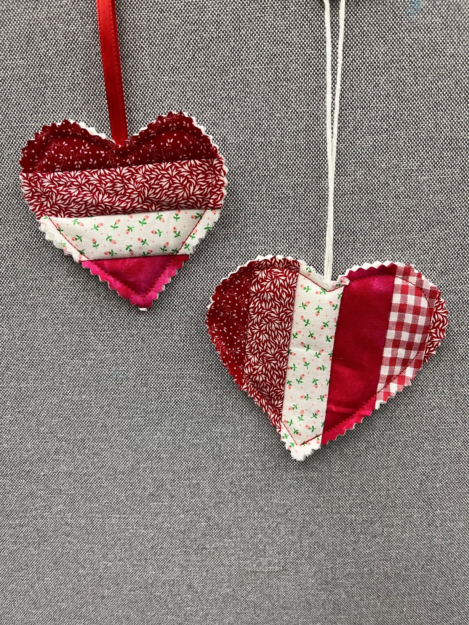 two quilted hearts in red and white stripes