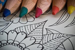 Colored pencils and blank coloring page