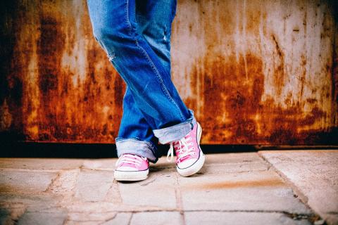 Teen wearing pink converse