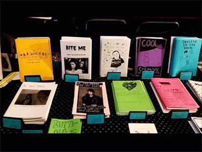A variety of zines on a table.