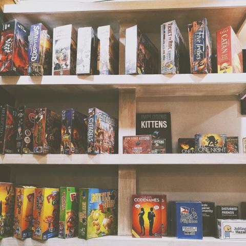 Three shelves of tabletop games