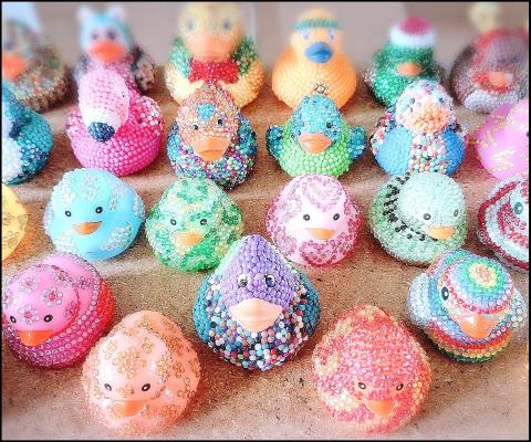 Rubber duckies covered in little plastic diamonds