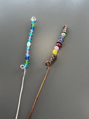 wire stakes decorated with colorful beads