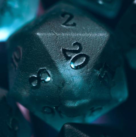 Blue dice pointing 20-side up.