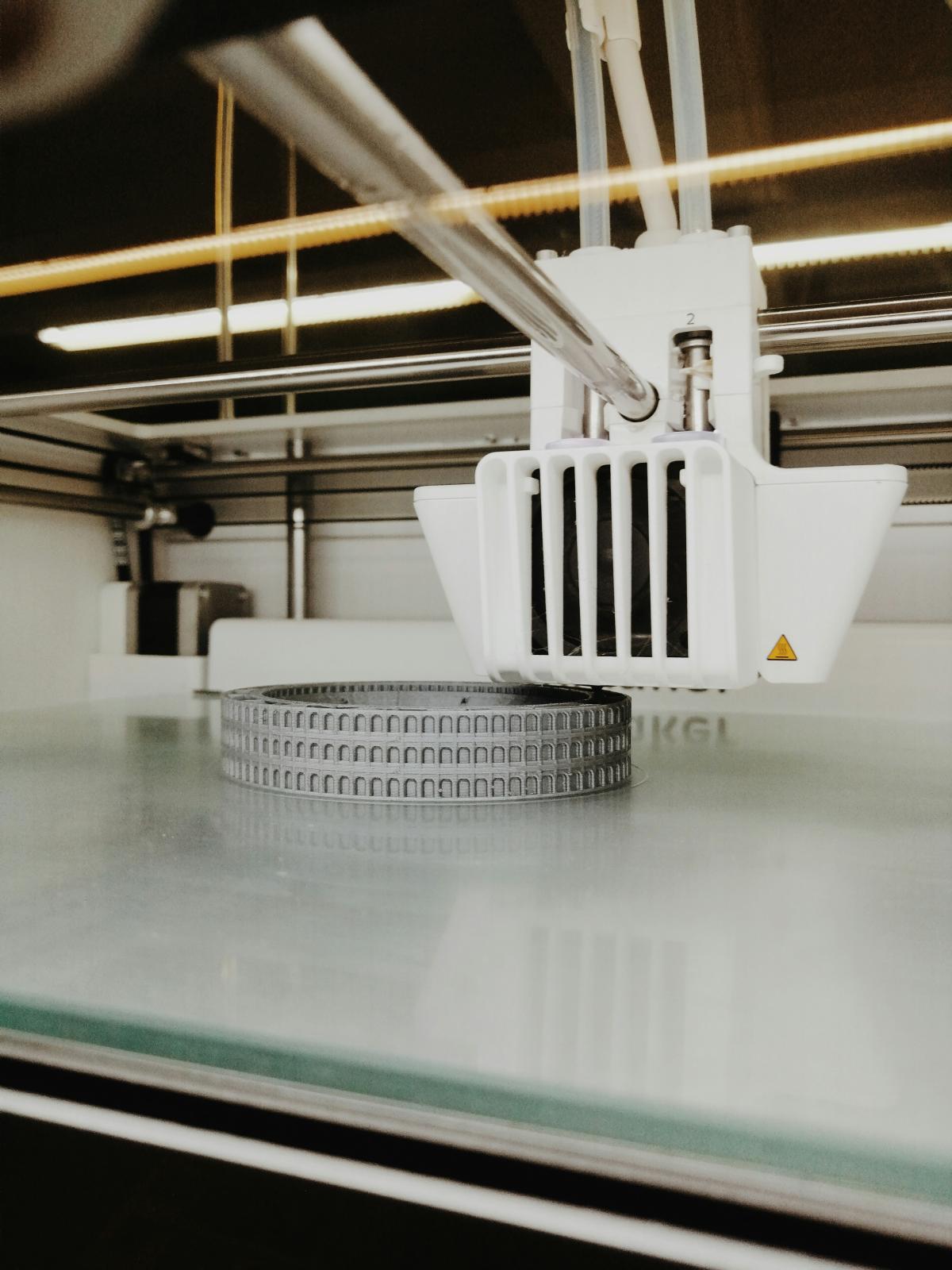 Ultimaker 3D printer printing a gray colosseum model