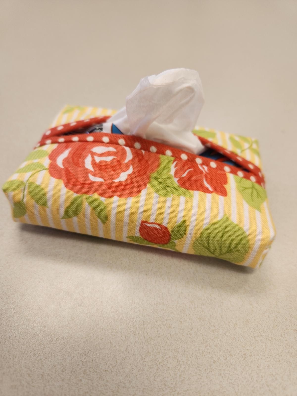 a yellow and red floral cloth mini tissue packet holder